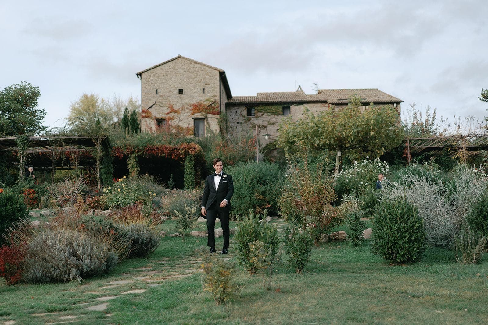 A stone farmhouse and its garden going over in late autumn